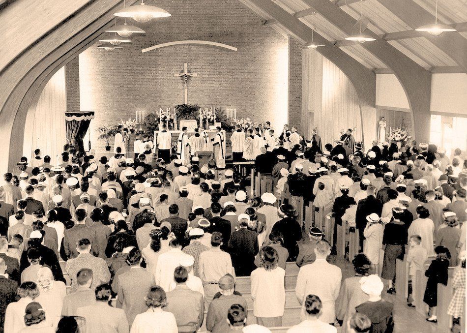 A large group of people are gathered in a church