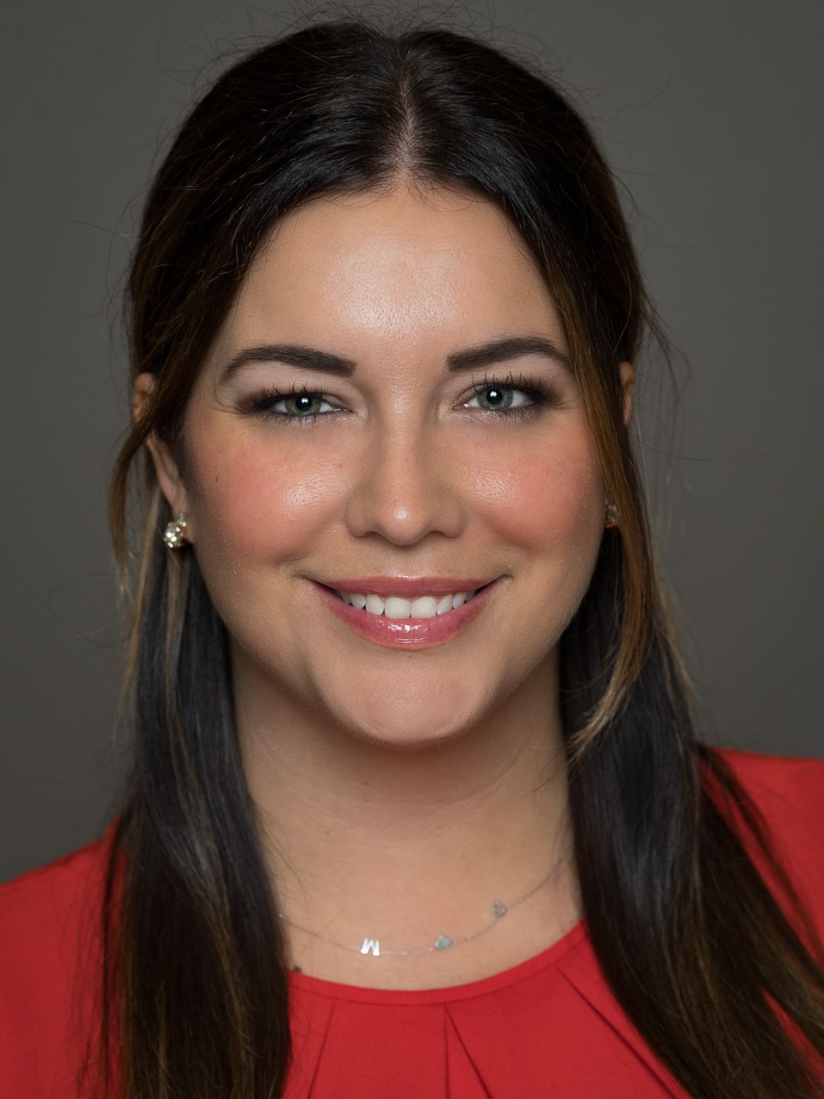 A knight 's helmet is shown in orange on a white background.