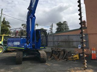 excavator with drill