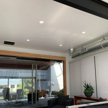 A living room with sliding glass doors and a couch