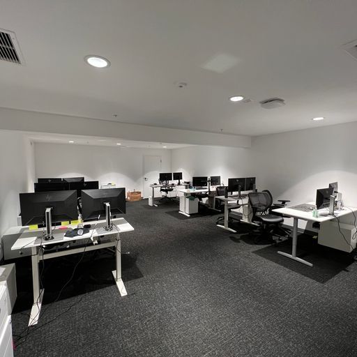 A large office with a lot of desks and chairs