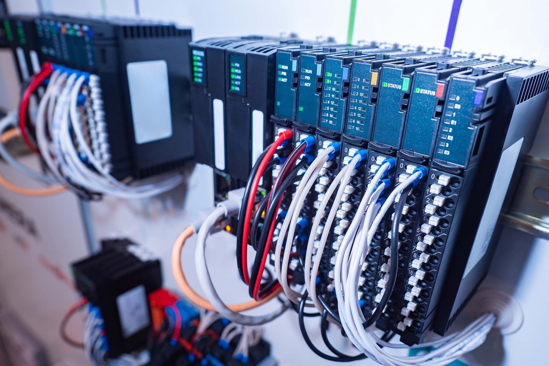 A bunch of electrical equipment is connected to each other in a room.