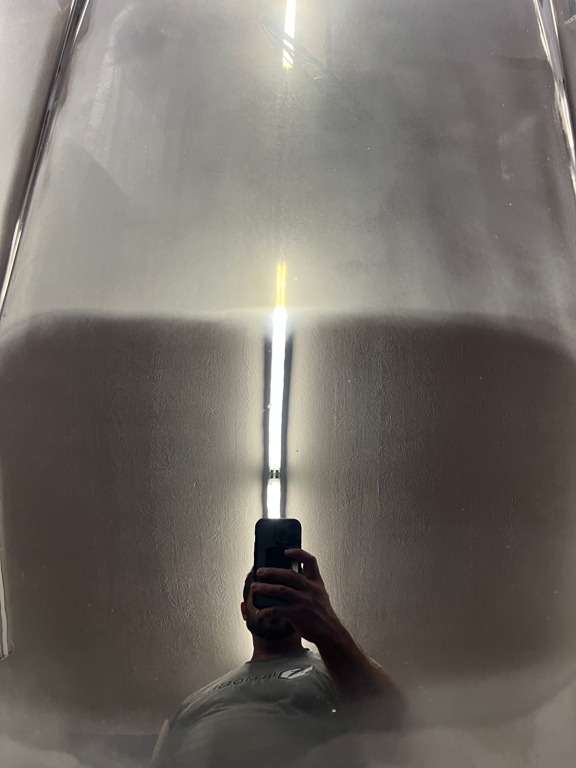 a blue car with deep scratches in need of car paint correction