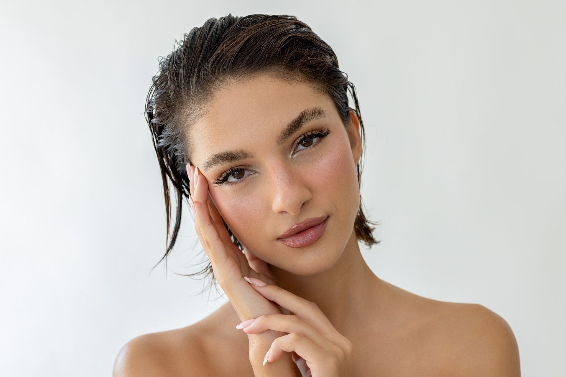 Close up portrait of a young white woman with wet hair