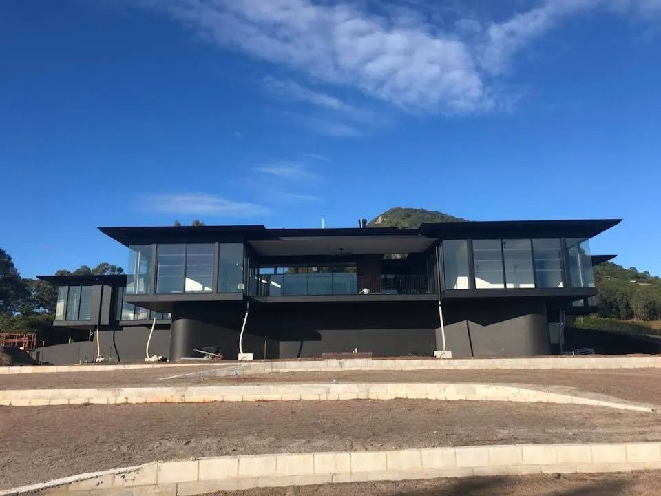 A Large Black House with A Lot of Windows and A Blue Sky in The Background — MJ Render in Buderim, QLD