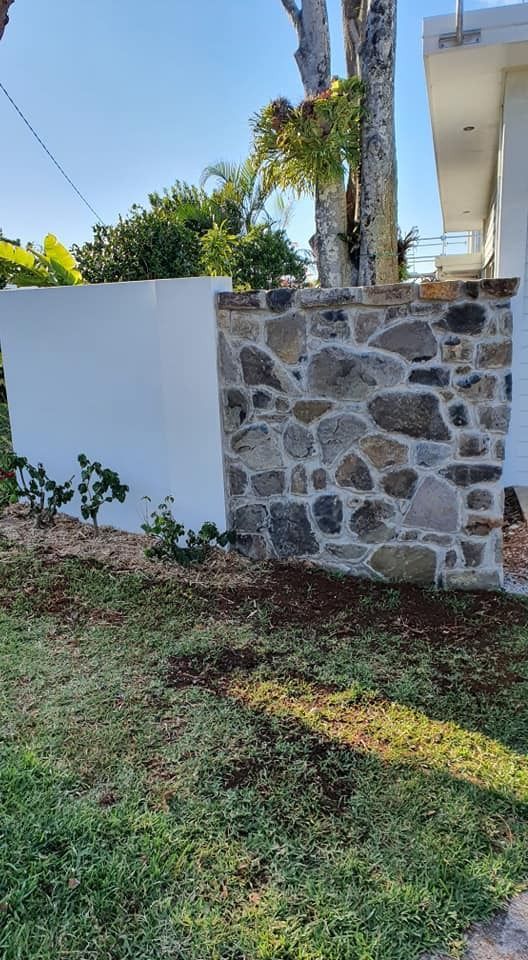 A Stone Wall with A White Block in The Middle of It in Front of A House — MJ Render in Buderim, QLD