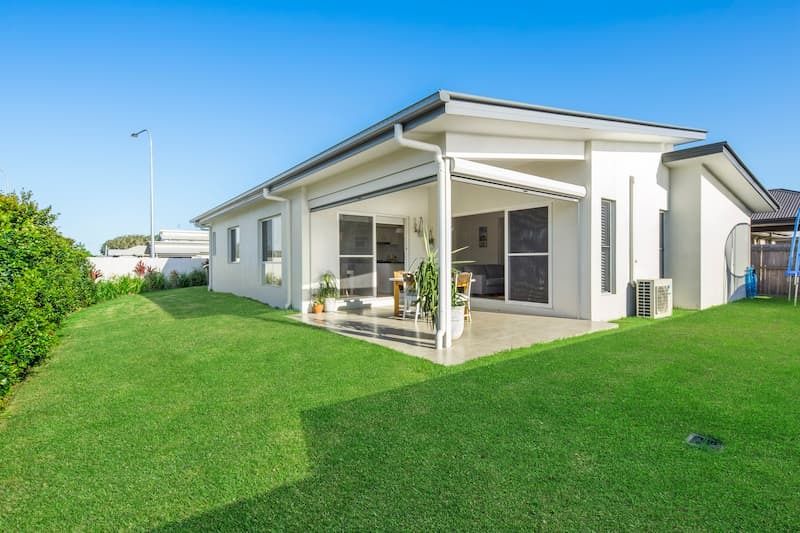 A White House with A Large Lawn in Front of It — MJ Render in Buderim, QLD