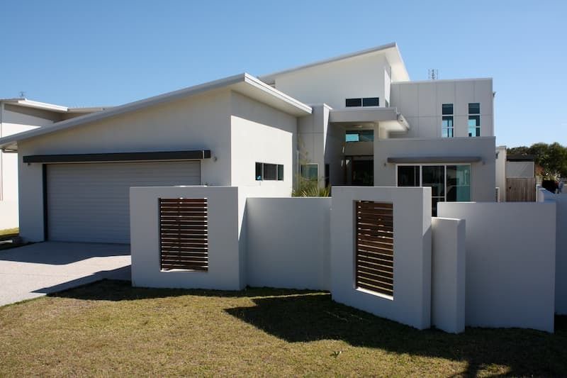 A White House with A Fence in Front of It — MJ Render in Buderim, QLD