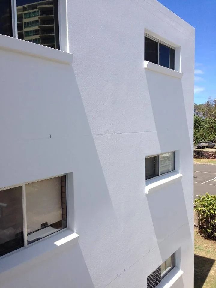 A White Building with A Lot of Windows on It — MJ Render in Buderim, QLD