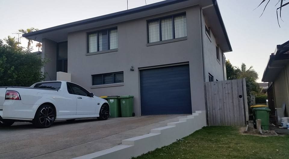 A White Truck Is Parked in Front of A Large House — MJ Render in Buderim, QLD