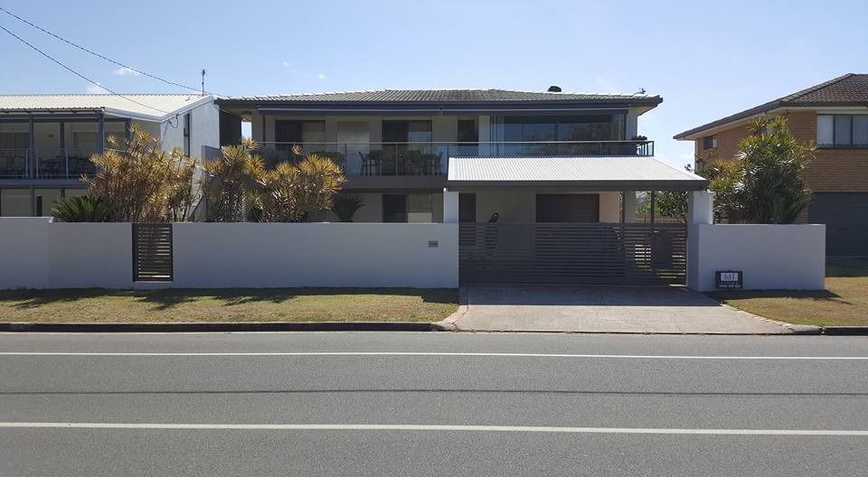 A Large House Is Sitting on The Side of A Road — MJ Render in Buderim, QLD