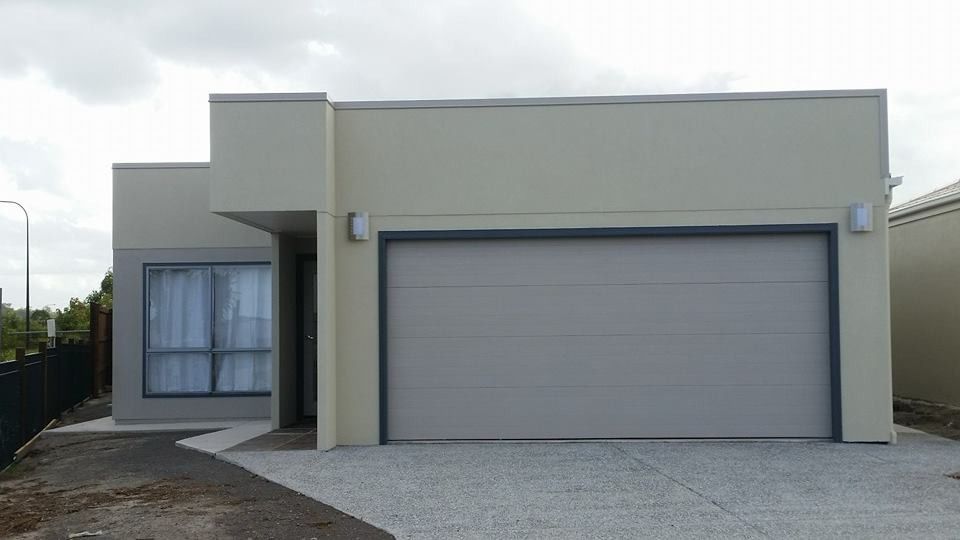 A White House with A Garage Door and A Driveway  — MJ Render in Buderim, QLD