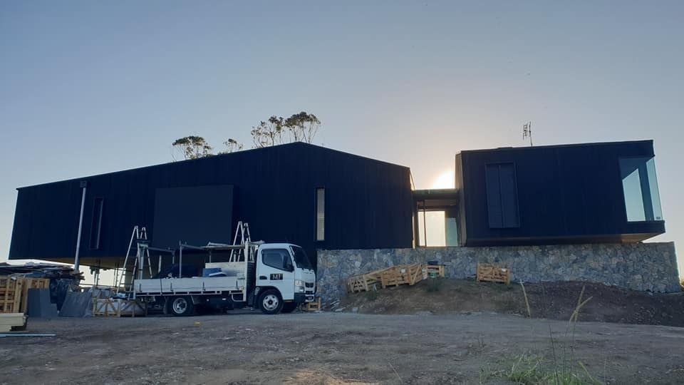 A White Truck Is Parked in Front of A Large Black Building  — MJ Render in Buderim, QLD