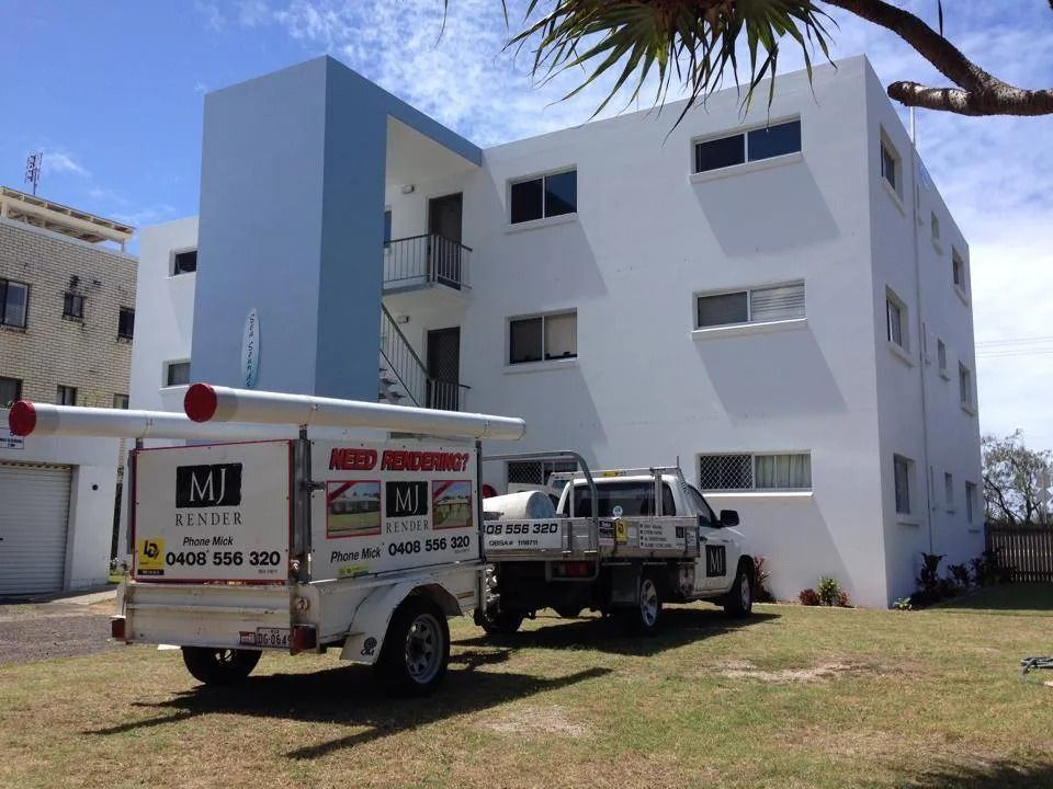 Two Trucks Parked in Front of A Building — MJ Render in Buderim, QLD