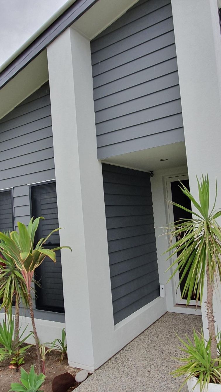 A White House with A Gray Siding and Palm Trees in Front of It — MJ Render in Buderim, QLD