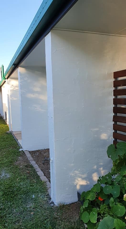 A White House with A Green Roof and A Wooden Fence — MJ Render in Buderim, QLD