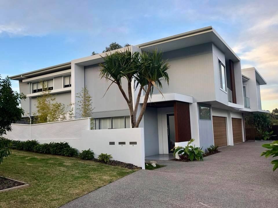 A Large House with A Tree in Front of It — MJ Render in Buderim, QLD