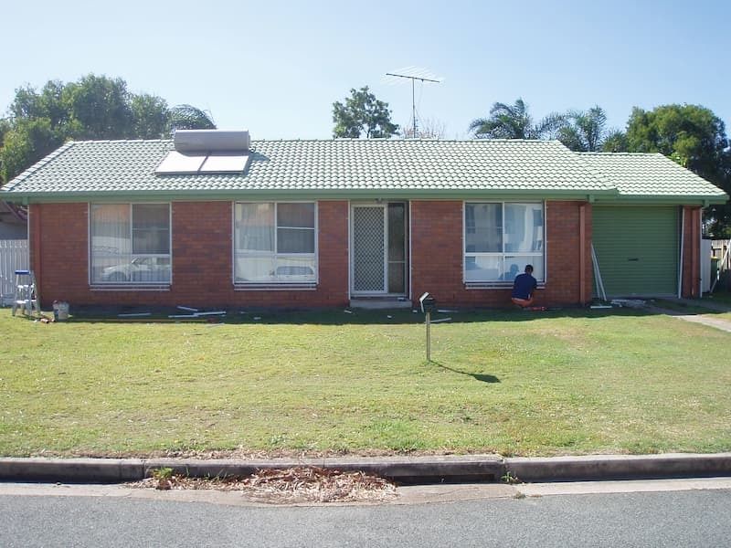A Brick House with A Green Roof and A Solar Panel on The Roof — MJ Render in Buderim, QLD