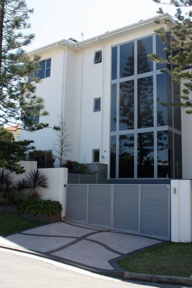 A Large White Building with Lots of Windows and A Gate — MJ Render in Buderim, QLD