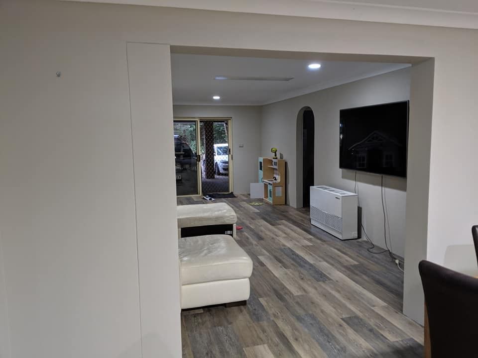 A Living Room with Hardwood Floors and A Flat Screen Tv — MJ Render in Buderim, QLD