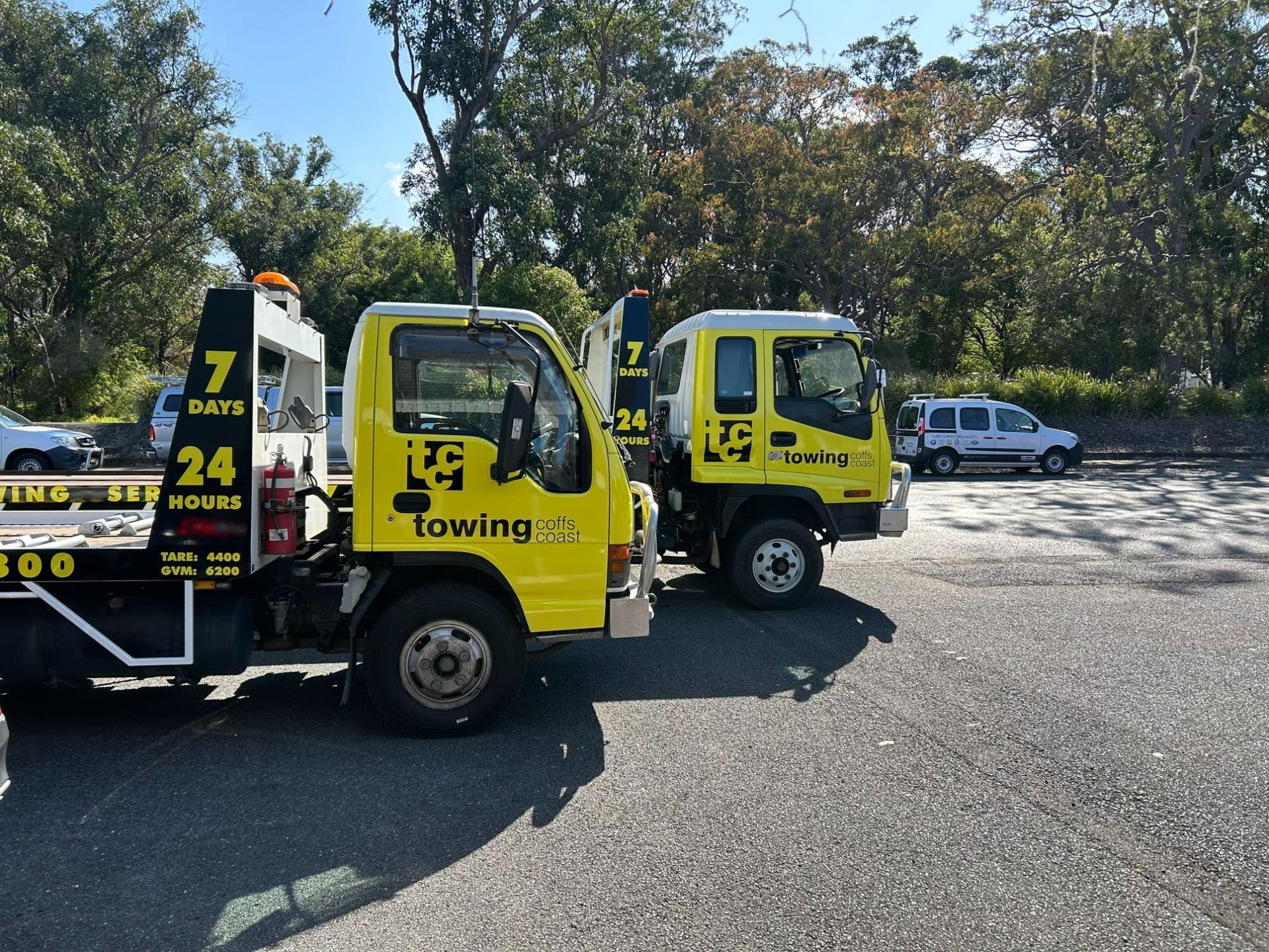 A Van Is Being Towed by A TCC Tow Truck — TCC Towing Coffs Coast in Harbour, NSW