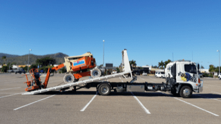 Loading Scissor Lift On To Tow Truck — Day & Night Towing & Transport in Townsville, QLD