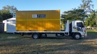 Yellow Storage Container Being Towed — Day & Night Towing & Transport in Townsville, QLD