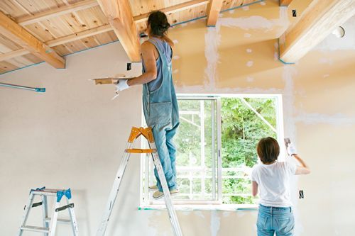 Two People Are Painting A Wall In A Room - Spring, TX - DJ's Painting