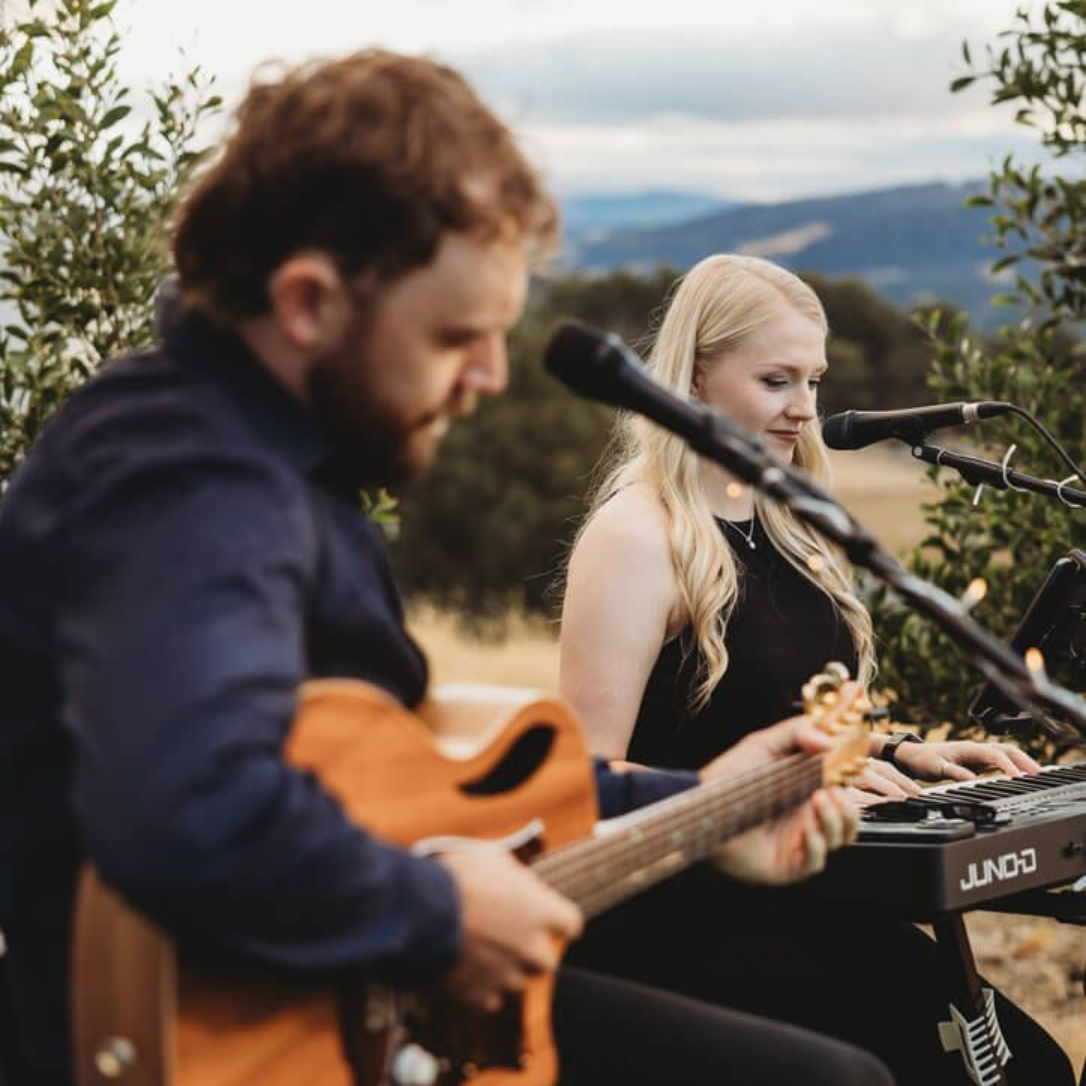 Brisbane acoustic musician playing guitar and singing at a wedding ceremony
