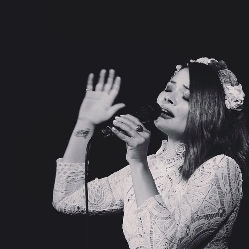 Sarah performing live music at a corporate event