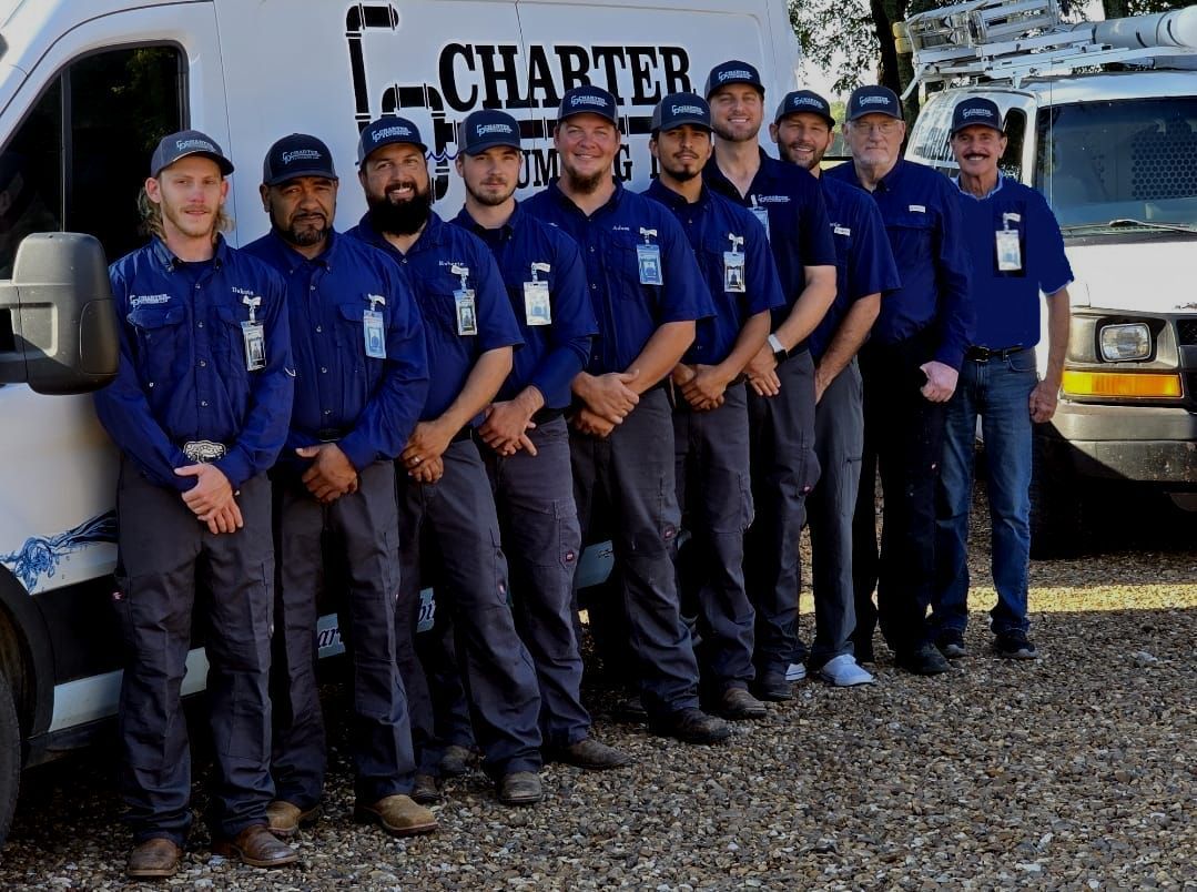 A group of men standing in front of a charter van