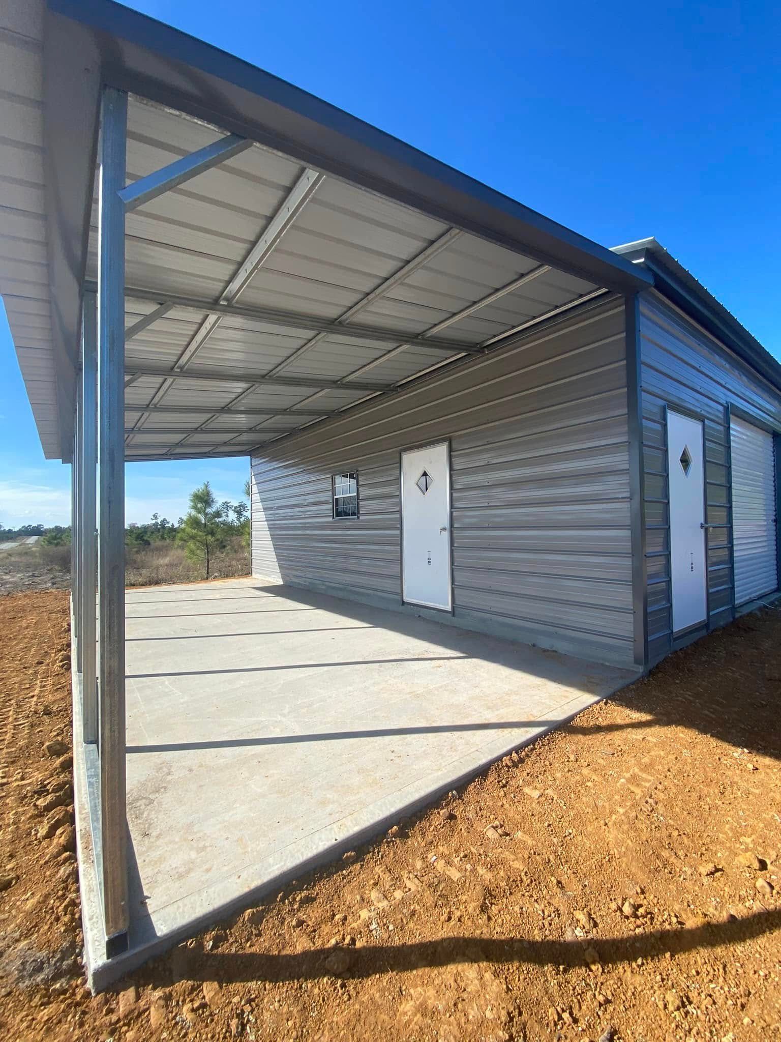 A metal building with a covered porch and two doors.