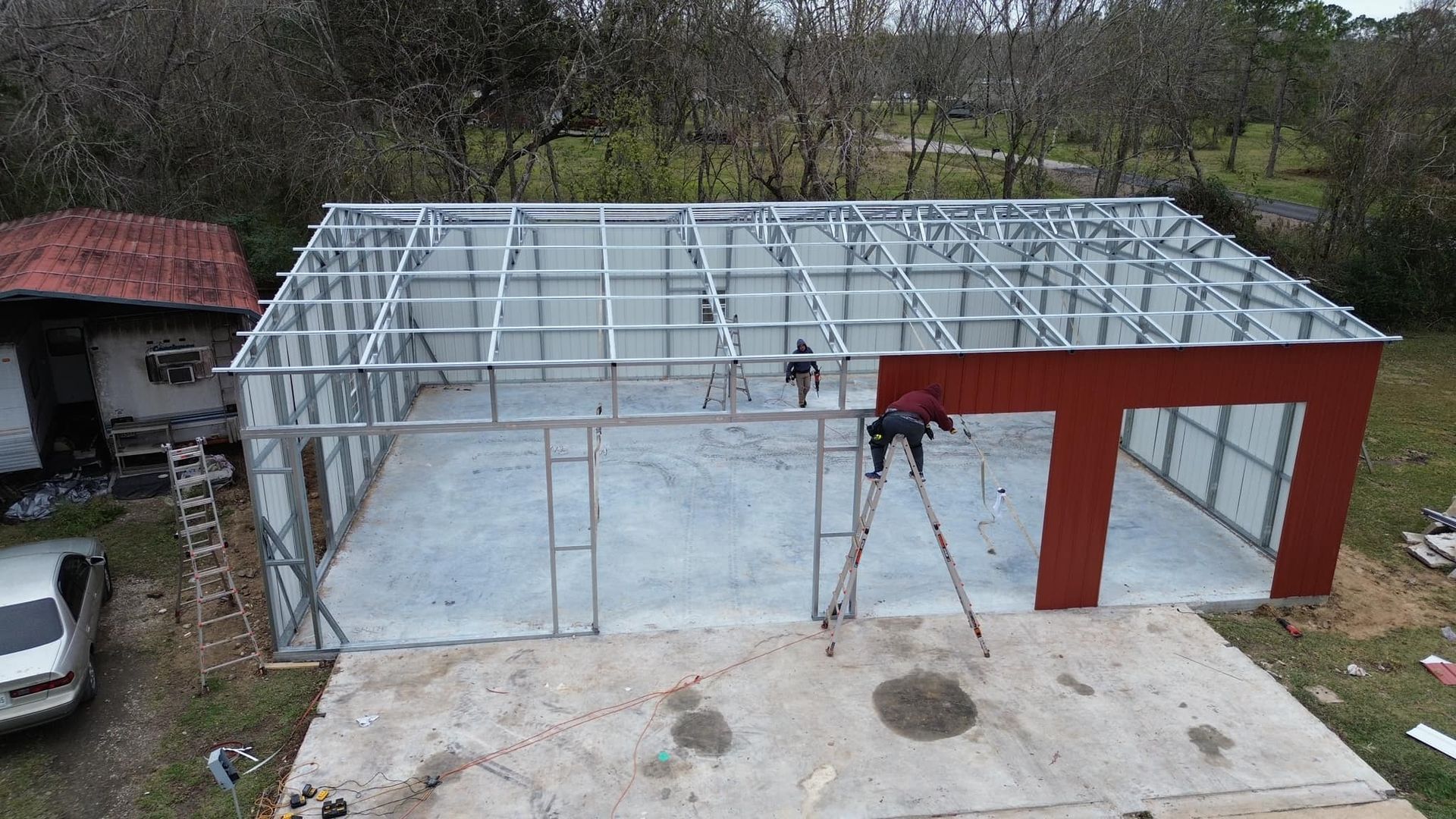 An aerial view of a building under construction in a yard
