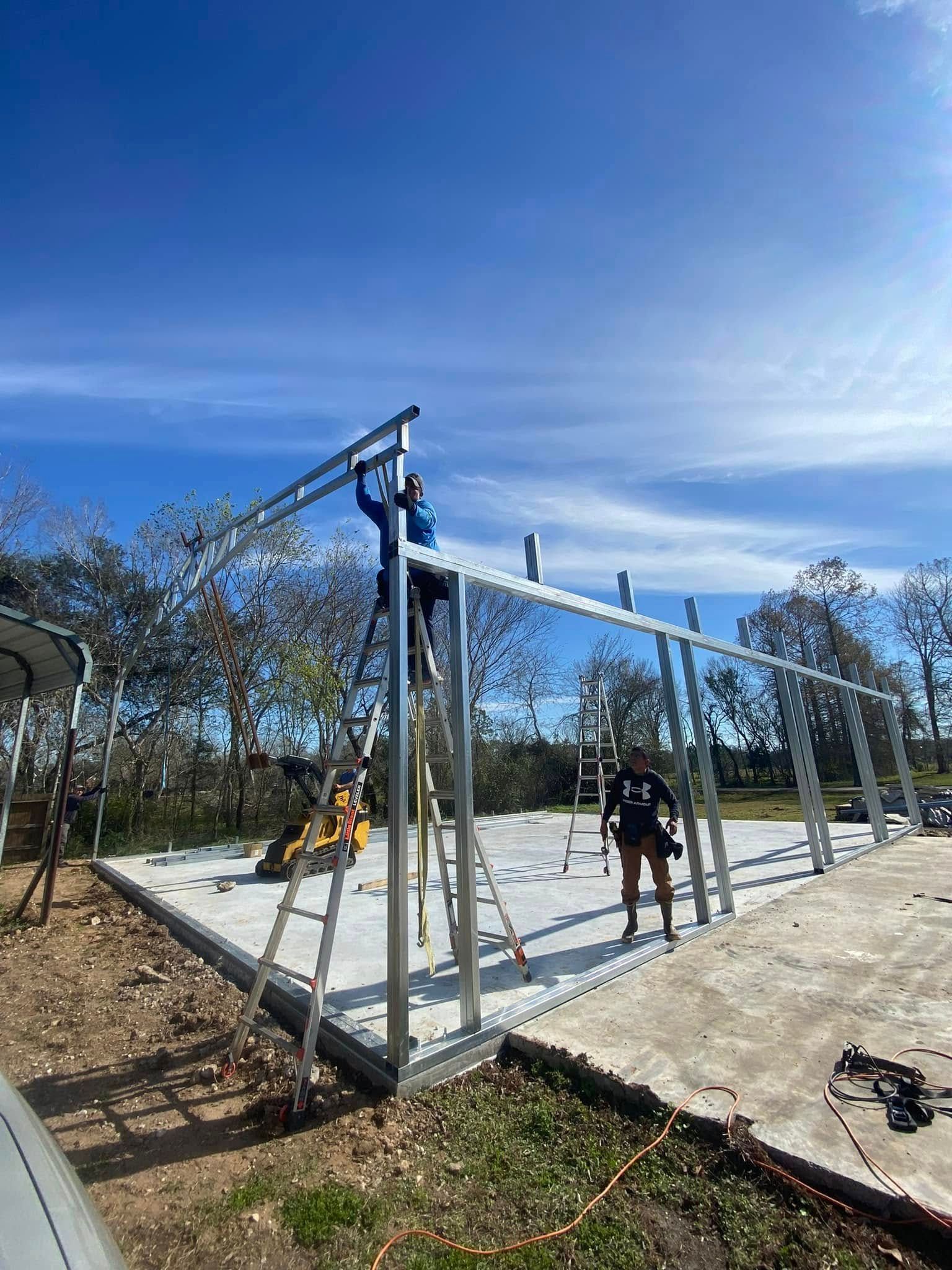 A group of people are working on a metal structure.