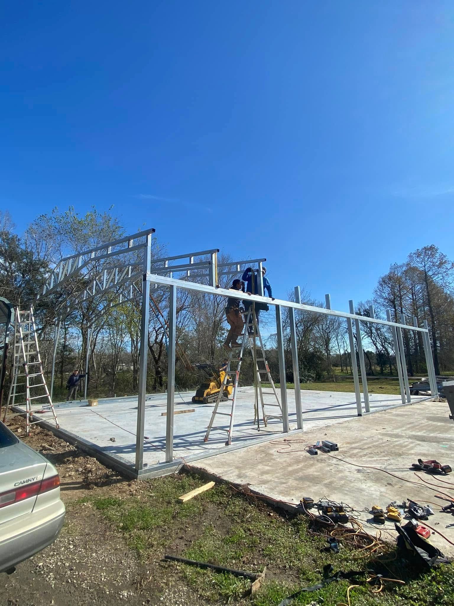 A man is working on a metal structure in a park.