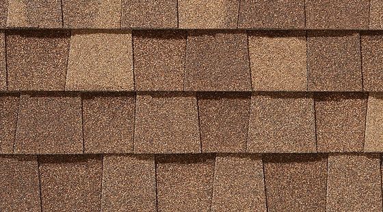 A close up of a brown shingle roof.