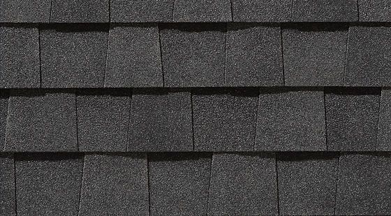 A close up of a black shingle roof.