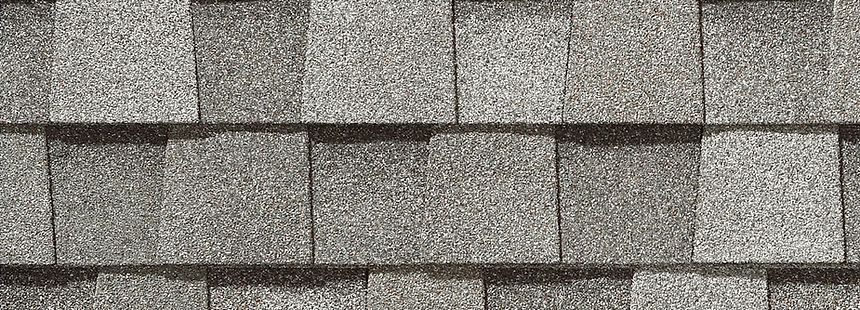 A close up of a roof with shingles on it.