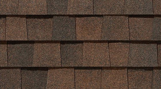 A close up of a roof with shingles on it.