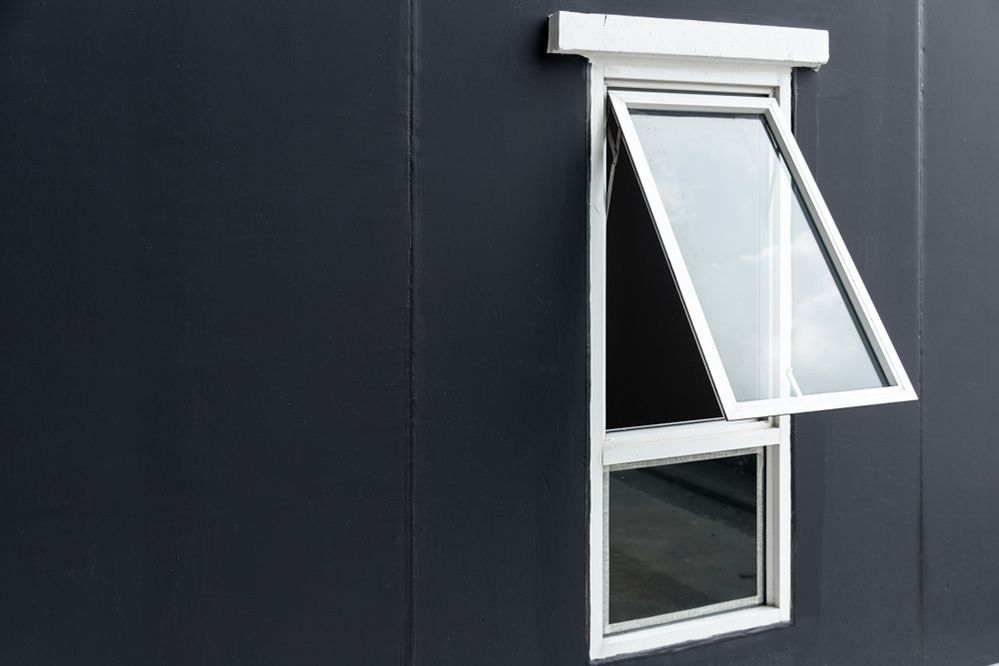A White Window Is Open On A Black Wall — Ace Glass & Aluminium In Grafton, NSW