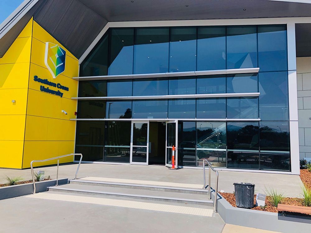 A Large Building With A Lot Of Glass Windows — Ace Glass & Aluminium In Grafton, NSW