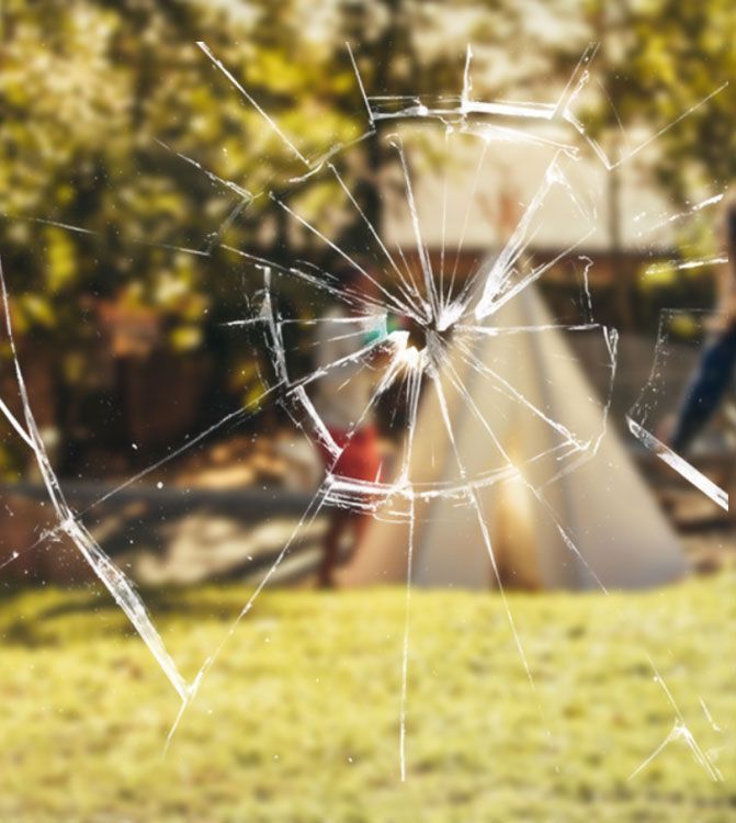 A Broken Glass Window With A Tent In The Background — Ace Glass & Aluminium In Grafton, NSW