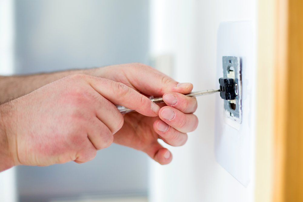 Installing Light Switch - Air Conditioning & Electrical In Bathurst, NSW