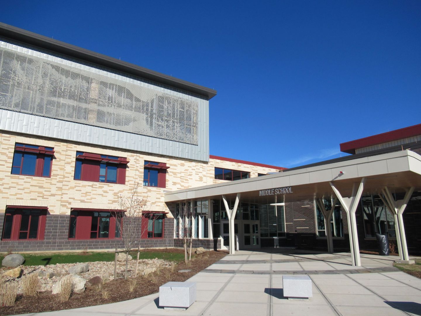 A large building with a sign that says body factory