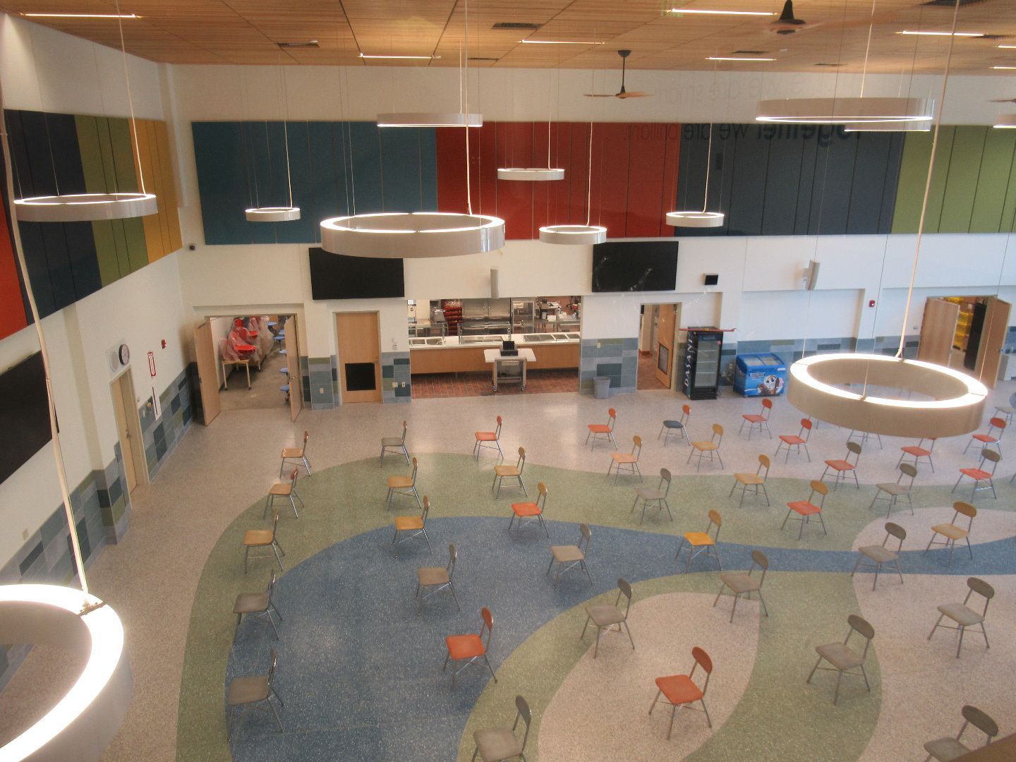 An aerial view of a large room with tables and chairs