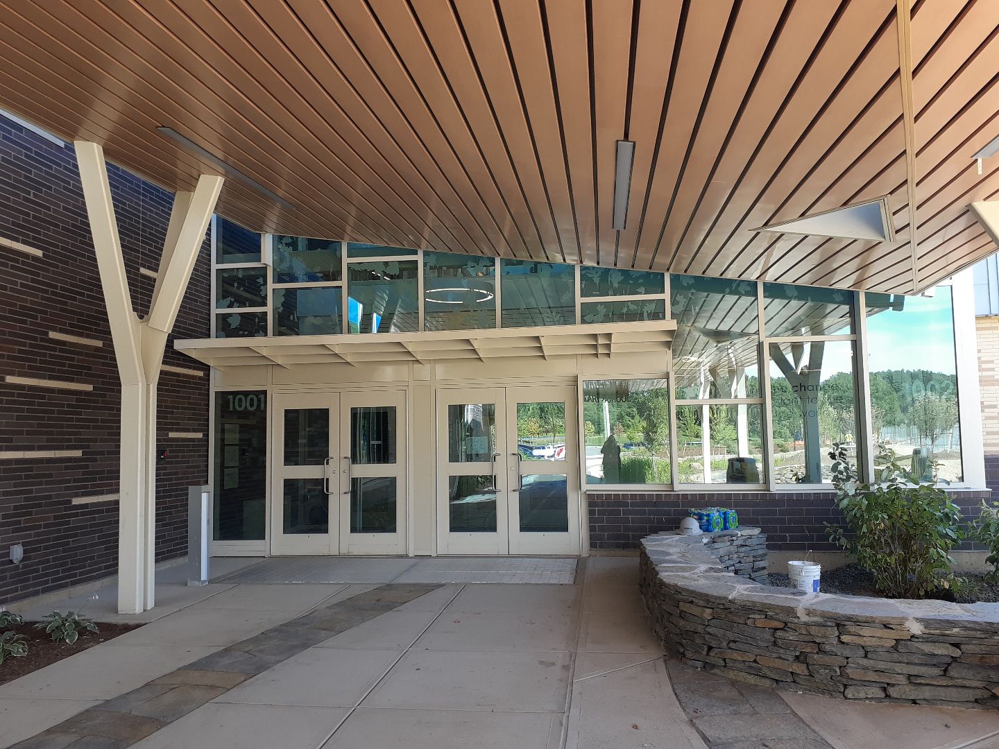 The entrance to a building with a canopy over it