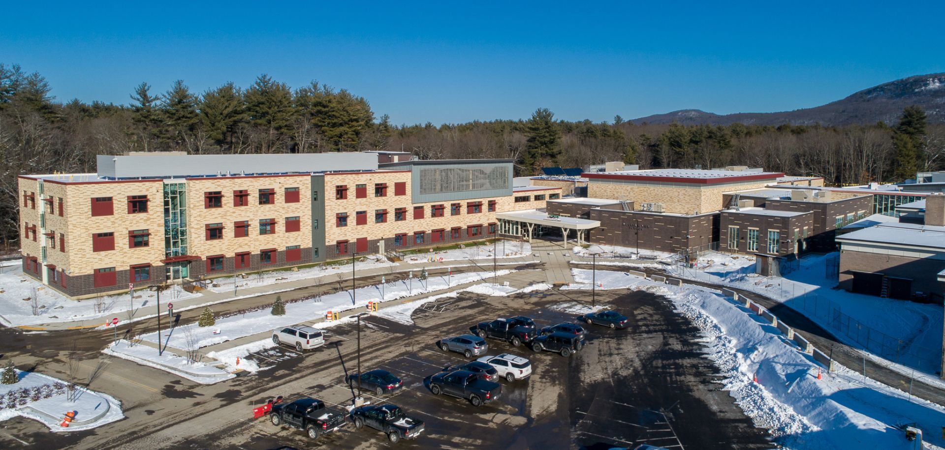 An aerial view of a large building in the snow