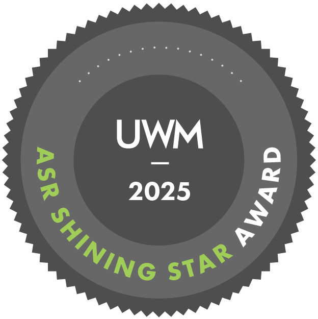 Award badge: UWM Shining Star Award. Gray and green circular emblem; text 