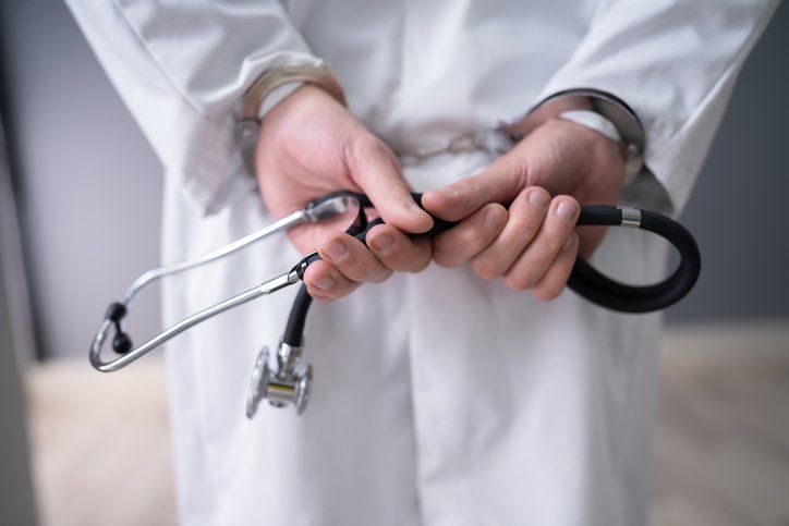 Doctor in Handcuffs — Commerce, CA — Lopez Law Group