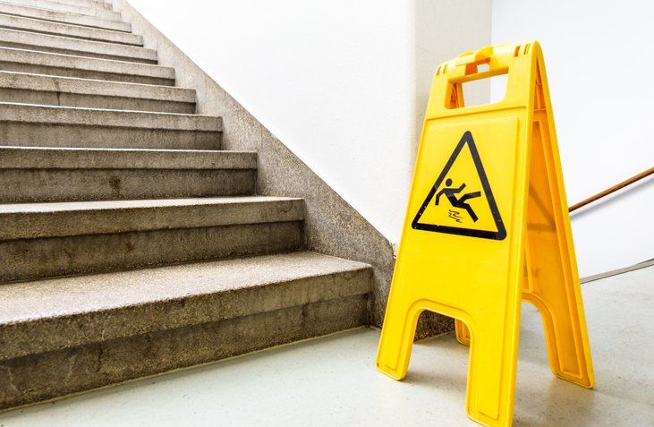 Slip & Fall Sign — Commerce, CA — Lopez Law Group